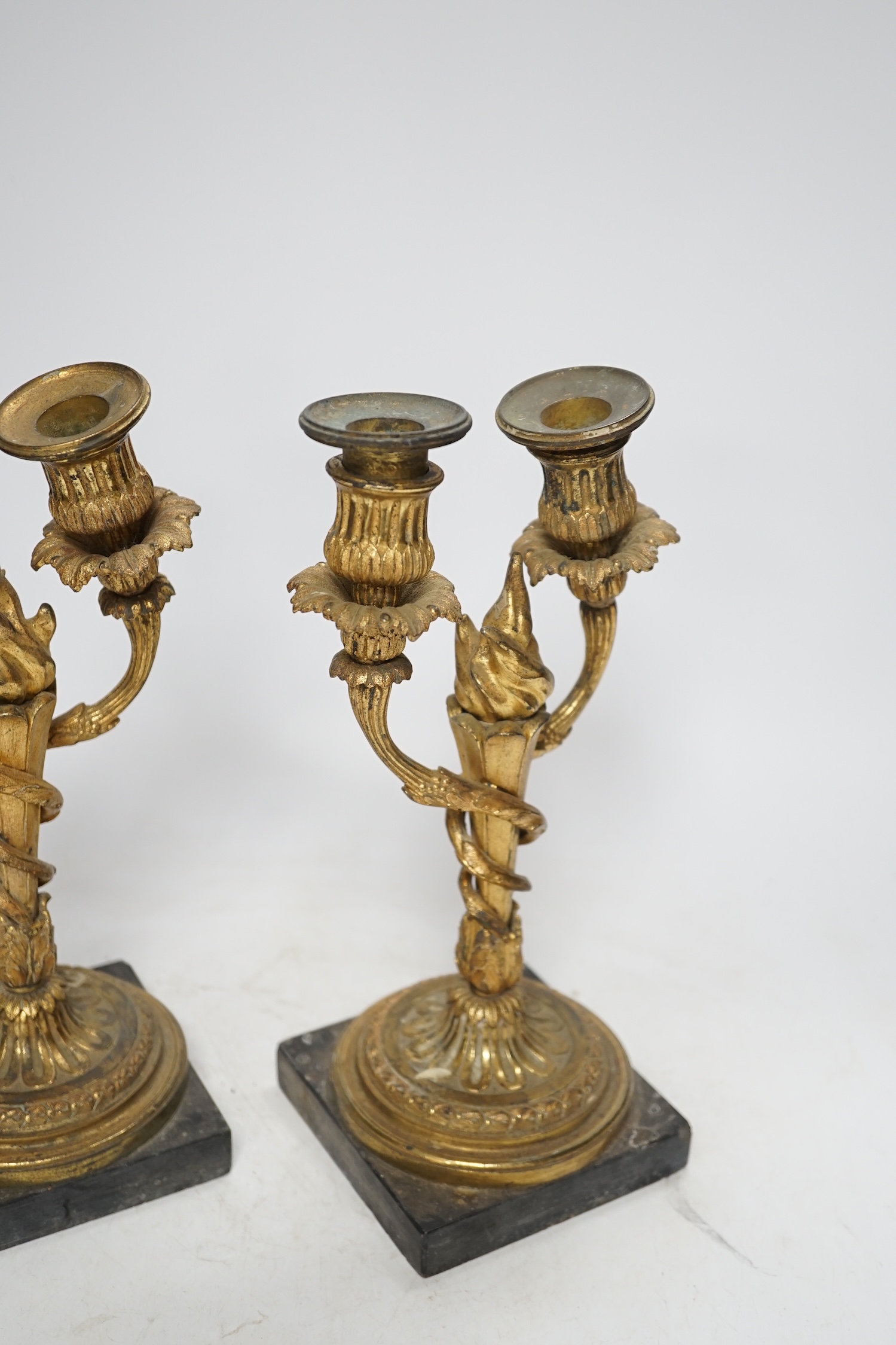 A pair of 19th century Louis XVI style gilt metal twin branch candelabra, 27cm. Condition - poor to fair